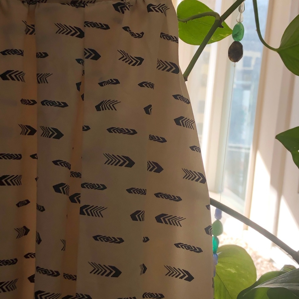 High waisted arrow skirt